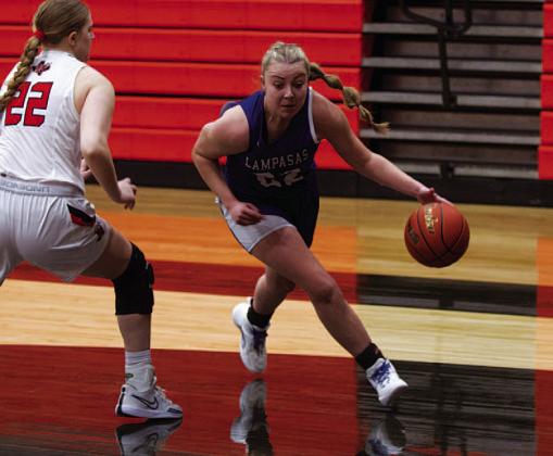 HUNTER KING | DISPATCH RECORD Kennedi Smart dribbles around a defender to drive the baseline.