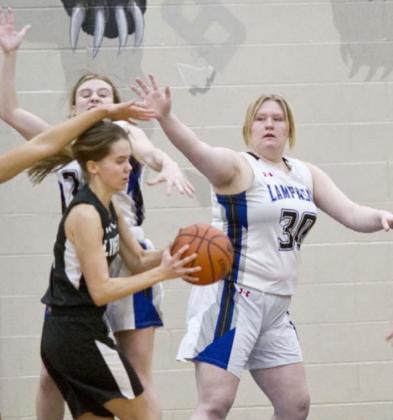 Kyliegh Ball (30) defends the lane against the Lady Falcons on Tuesday. JEFF LOWE | DISPATCH RECORD