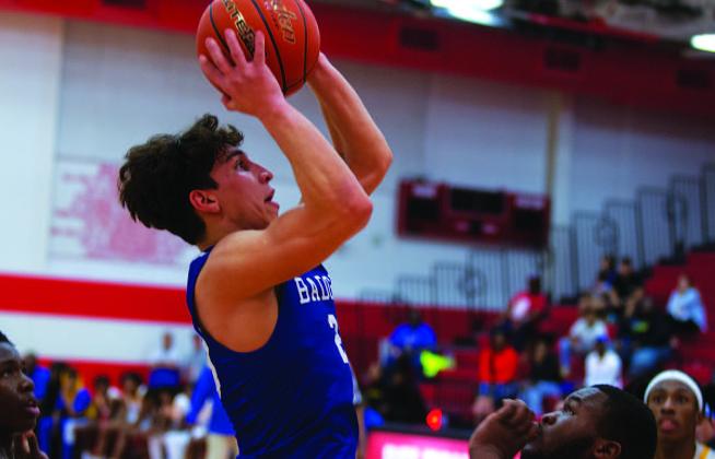 HUNTER KING | DISPATCH RECORD Ethan Moreno shoots over a Waco La Vega defender for two points in Tuesday’s playoff matchup.