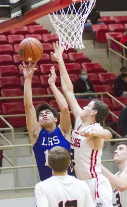 Tak Stinnett (shown shooting in a previous game) and Nate Borchardt (not pictured) had the Badgers’ only three-pointers in a district-opener victory with mostly two-point baskets. JEFF LOWE | DISPATCH RECORD