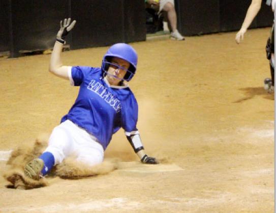 Lady Badger senior outfielder Rose McAnally slides home for a run in Tuesday’s game at Burnet. DONNA MCANALLY | COURTESY PHOTO
