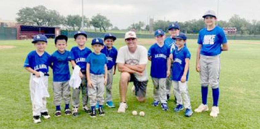 Youth baseball players train under elite 5A coach