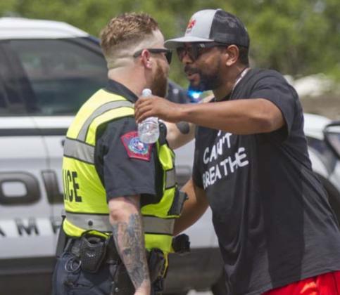 Lampasas police officer Josh Watson, left, and Russell Smith hug as Smith joined a march protesting the death of Minneapolis man George Floyd. Watson worked on traffic control during the march. Two local events in June that focused on Floyd and racial issues had “no incidents of any kind to include damage to property or violence,” Chief of Police Sammy Bailey said. FILE PHOTO