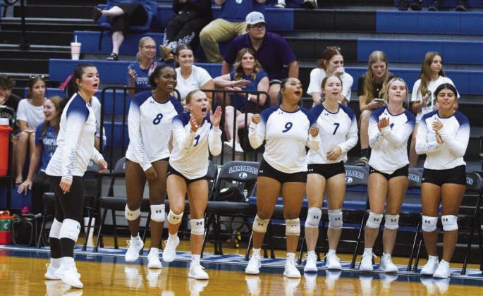 The Lady Badger volleyball bench was on their feet to help push teammates over the line to victory during Tuesday’s opening game against Manor New Tech. ERICK MITCHELL | DISPATCH RECORD