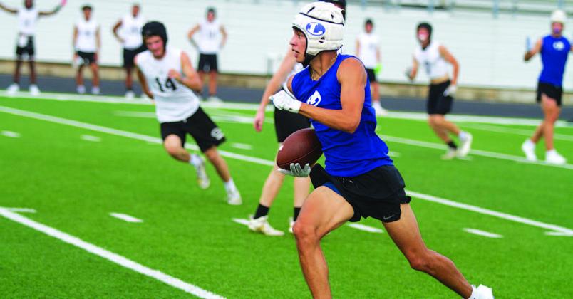 Jonah Sanchez runs up field after catching a pass during 7-on-7. HUNTER KING | DISPATCH RECORD