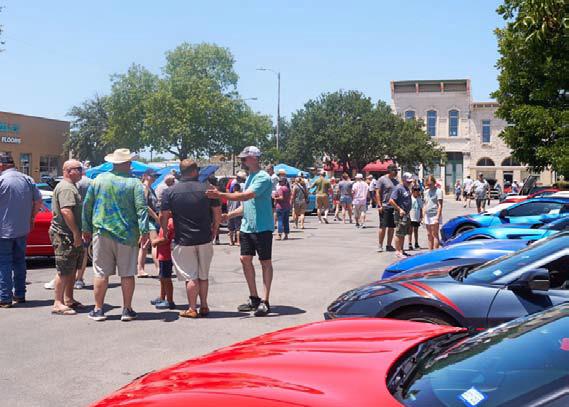 ADAM BARRIOS | DISPATCH RECORD Crowds stroll the courthouse square to view classic, vintage and antique cars from nearly every decade.