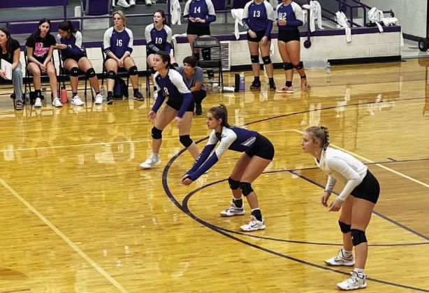 Gracey Ullevig, left, Kayli Syx and Bre Quarles step into position during the Marble Falls match. COURTESY PHOTO