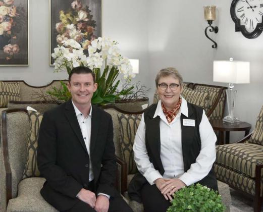 Heritage Funeral Homes co-owner Dr. James Mercer and Funeral Director Sally Bozeman are in the sitting room of the newly renovated funeral home. Mercer and Bozeman first worked together to provide funeral services in the late 1990s. MADELEINE MILLER | DISPATCH RECORD
