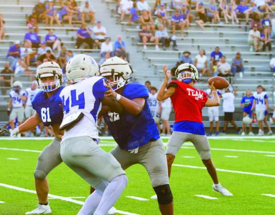 At right, Tripp Stinnett prepares to throw the ball down field during Lampasas High’s scrimmage against the McCallum Knights on Thursday in downtown Austin. ERICK MITCHELL | DISPATCH RECORD