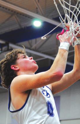 Nate Borchardt cuts down the net at the Badger Den after Lampasas won the district championship. HUNTER KING | DISPATCH RECORD