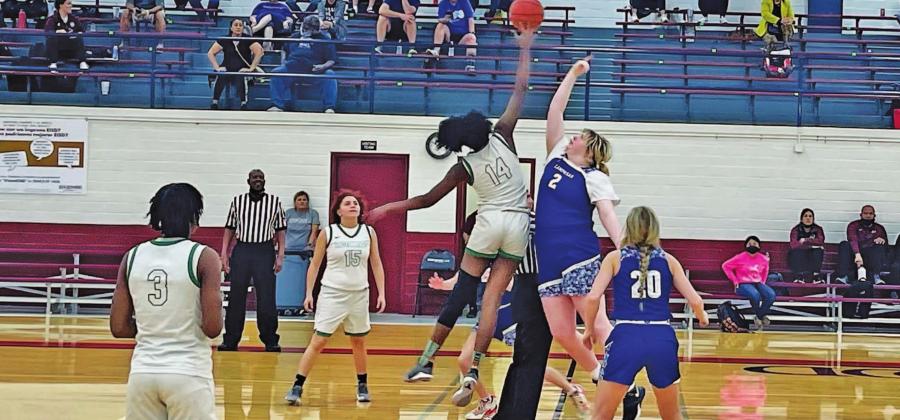 Morgan Lovejoy goes up for the opening tip during a game in the Edgewood tournament over the weekend. Also pictured is Cobie Chandler. COURTESY PHOTO