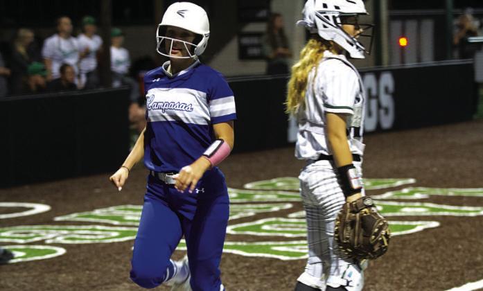 HUNTER KING | DISPATCH RECORD Bre Quarles jogs into home plate to score one of the Lady Badgers’ three runs.
