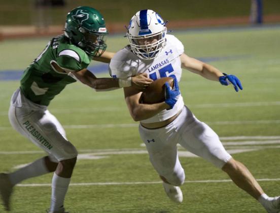 Case Brister attempts to make a defender miss while running down the sideline in the Badgers’ first-round playoff game against Pleasanton last Friday. HUNTER KING | DISPATCH RECORD
