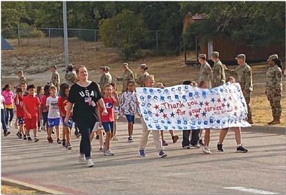 Taylor Creek Elementary students walk around campus during Monday’s parade to honor 9/11 heroes. courtesy photo