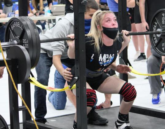 Three-time state qualifier Alyssa Ayers squats in the powerlifting season opener in Lampasas. CHRIS YBARRA | DISPATCH RECORD