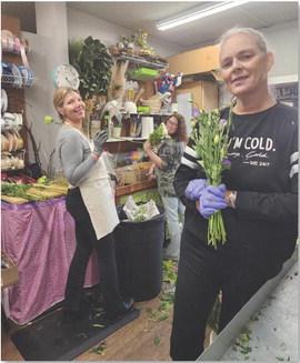 Gina Allman, Bridgette Leatherman and Elaine Leatherman, florists at The Shoppe on Key Avenue, process flowers on Wednesday in preparation for Valentine’s Day. COURTESY PHOTO | THE SHOPPE ON KEY AVENUE