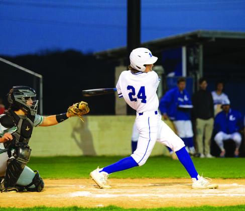 Timber Gholson connects on one of his hits during Tuesday night’s game against Burnet. HUNTER KING | DISPATCH RECORD