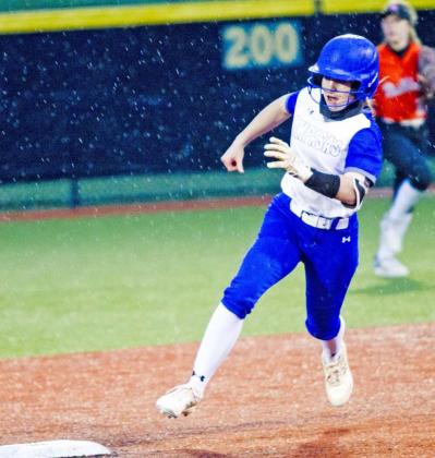 LHS freshman Aspen Wheeler rounds second base on a triple in game one of the bi-district playoffs. JEFF LOWE | DISPATCH RECORD