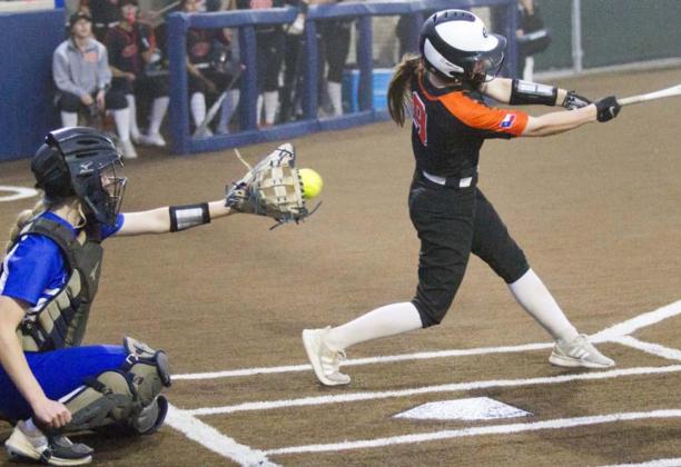 Kali Hunter catches a strike from Caitlyn Sanguinet in game two at Stephenville. JEFF LOWE | DISPATCH RECORD