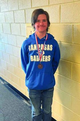 Kayden Biggars shows off his third-place medal for ready writing. COURTESY PHOTO