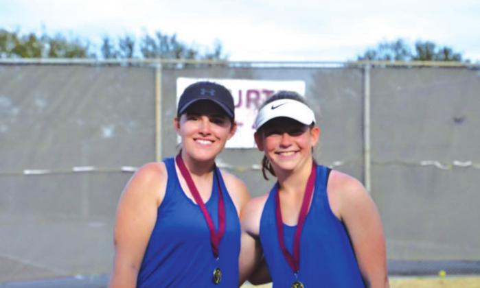 Kailr Clements, left, and Abby Valdez, pose with their first-place medals after winning in Brownwood last week. COURTESY PHOTO