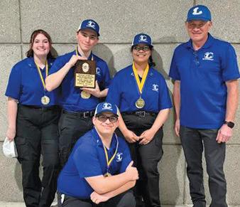 The LHS state-champion traffic stop team includes, from left to right, Lily Stephen, Jason Brock, Lena Jeffries, instructor Michael Tatum and Bryce Neely, kneeling front and center. erick mitchell | dispatch record