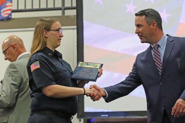 Bailey Harner is awarded Firefighter of the Year honors for Kempner Volunteer Fire Department. She accepts her award from 424th District Court Judge Evan Stubbs. COURTESY PHOTO | HILL COUNTRY 100 CLUB