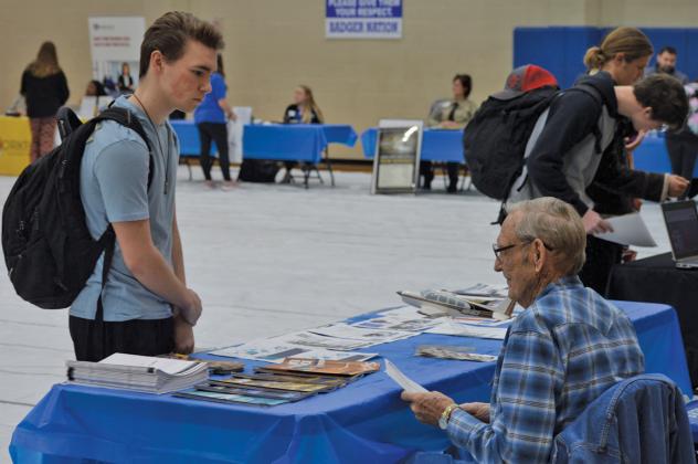 erick mitchell | dispatch record At left, Jason Brock speaks with a representative from the Lampasas County Pilot’s Association during the high school job fair last week.
