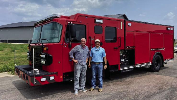 Former fire chief Jeff Smith and engineer Jared Payne stand in front of the Spartan NXT pumper after the truck completed its final inspection in South Dakota last August. The new addition for the Lampasas Fire Department is ready to be officially put into service. FILE PHOTO