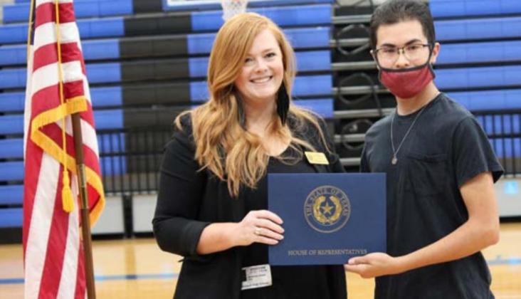 District Director Jessica Diem presents a certificate of recognition to senior Christian Carrasco on behalf of State Rep. Brad Buckley. CHRIS YBARRA | DISPATCH RECORD