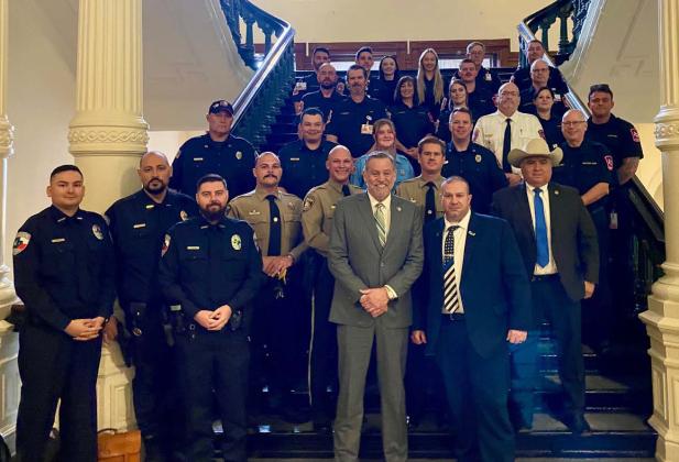 District 68 State Rep. David Spiller, in center, stands with a group of emergency responders who assisted with a river rescue last month when two Kempner-area boys were trapped in a cave. The Texas House passed HR 1080 last week to recognize the service of these first responders. courtesy photo