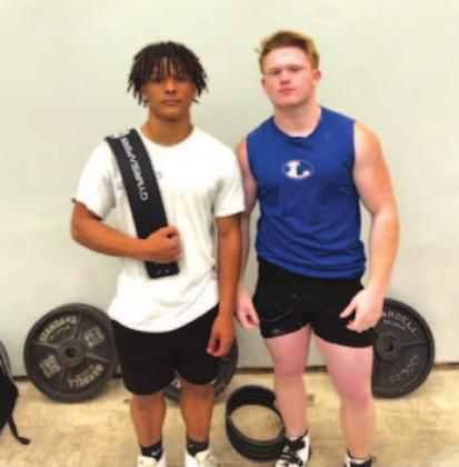 Dominique Wooten, left, and Westen Reid, pose for a photo at the state powerlifting meet over the weekend. COURTESY PHOTO