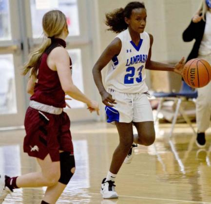 Nattie Martin drives down the court in the ninth-grade game. JEFF LOWE | DISPATCH RECORD
