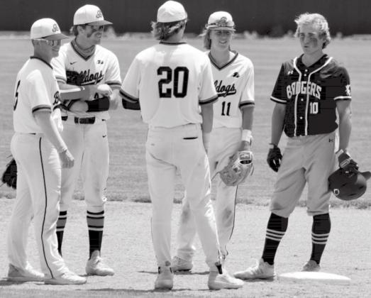 During a pitching change, the Burkburnett infield stops by second base to talk with Ace Whitehead after one of the last at-bats of his high school career. JEFF LOWE | DISPATCH RECORD