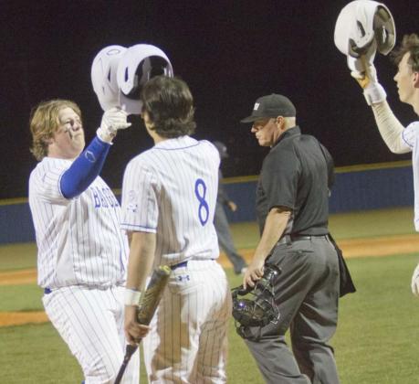 First baseman Hayden Waldrip, left, Tak Stinnett and other teammates celebrate Waldrip’s three-run homer in the seventh inning. That shot cut the Hornets’ lead down to one run, but Gatesville still defeated Lampasas. JEFF LOWE | DISPATCH RECORD