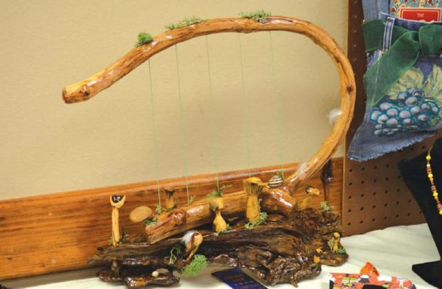 Entrants in the craft division made various items, such as purses, or the wood carving seen here. MASON HINES | DISPATCH RECORD