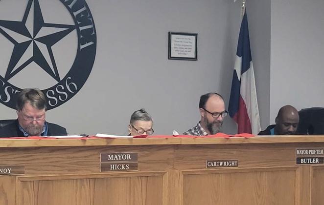 The Lometa City Council members scrutinize the city’s bills during a meeting last week at City Hall. Pictured, from left to right, are Mayor Stephen Brister, Councilwoman Ronnie Cartwright, Mayor Pro-Tem Bob Butler and Councilman Jaelyn Downey. Cherí Jay-Wienecke | Dispatch record