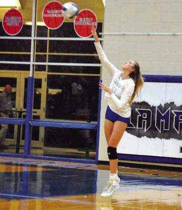 Breana Pelbath swings through a serve against the Shoemaker Lady Grey Wolves. HUNTER KING | DISPATCH RECORD