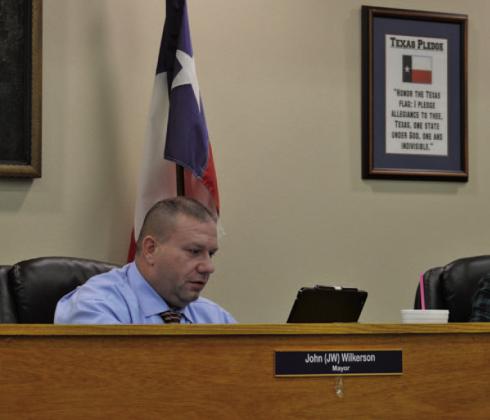 Mayor John Wilkerson looks over statistics regarding the special sales tax during Tuesday’s Kempner City Council meeting. ERICK MITCHELL | DISPATCH RECORD