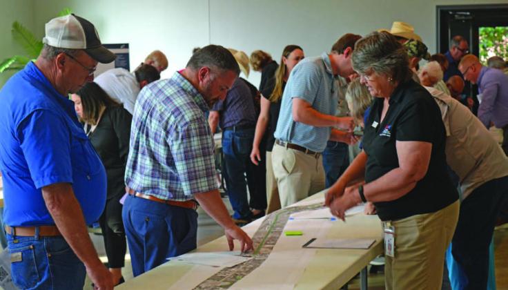 County residents speak with TxDOT officials before last week’s presentation on the U.S. Highway 281 Lampasas-to-Evant improvement project. ERICK MITCHELL | DISPATCH DISPATCH
