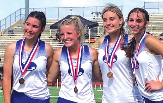 Gracie Ullevig, left, Morgan Myers, Cobie Chandler and Landry White pose for a photo after finishing fourth in the 4x200-meter relay. COURTESY PHOTO