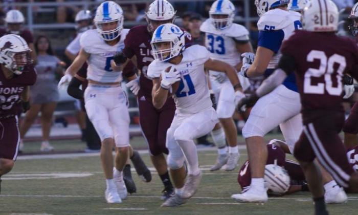 Ethan Moreno runs through the middle against Brownwood in week one. HUNTER KING | DISPATCH RECORD