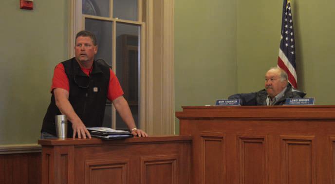 At left, John Stokes of All Seaons Service Inc. provides the Commissioners Court with an update regarding repairs to the HVAC systems in the county annex building at 407 S. Pecan St. ERICK MITCHELL | DISPATCH RECORD