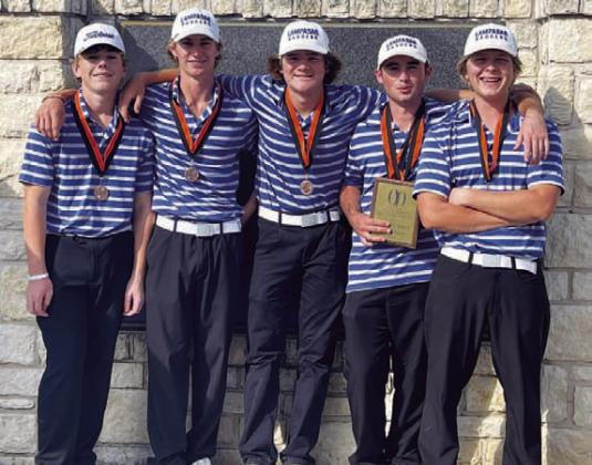 COURTESY PHOTO The Badger golf team poses with their medals and plaque.