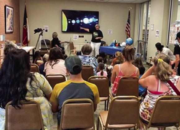 Lampasas County Friends of the Night Sky was a part of the Lampasas Public Library’s Summer Reading Program for kids ages 3-10. Here, Dianna Hodges discusses the 2024 Solar Eclipse with the group. COURTESY PHOTO | FRIENDS OF THE NIGHT SKY
