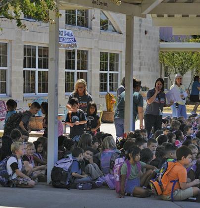 Students at Hanna Springs Elementary School await their rides home after the first day of classes. On the first day of the new term, the campus showed an enrollment of 714. Those numbers were expected to increase slightly over the early part of the 2023-24 school year. ERICK MITCHELL | DISPATCH RECORD