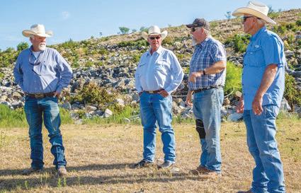 chris miles | dispatch record Sam Middleton of the Lubbock-based Chas. S. Middleton brokerage firm learns about the history of the Pillar Bluff Ranch. Pictured, left to right, are Kim Vann, Middleton, Kirk Vann and Robby Vann.
