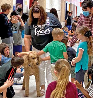 courtesy photo Tayt was a beloved campus dog at Taylor Creek Elementary School who retired in 2021 along with principal Renee Cummings.