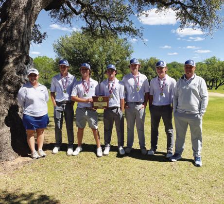 The boys’ golf team poses with their first-place medals and plaque from the district golf tournament. COURTESY PHOTO | GERRY SPORE