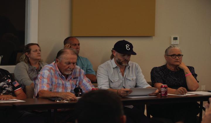 Lampasas Economic Development Corporation board members Deorald Finney (left), Fin Erwin and Tonja Gerbert listen to a presentation from EDC Specialist Mike Gill before discussing future plans with City Council Oct. 21. ERICK MITCHELL | DISPATCH RECORD